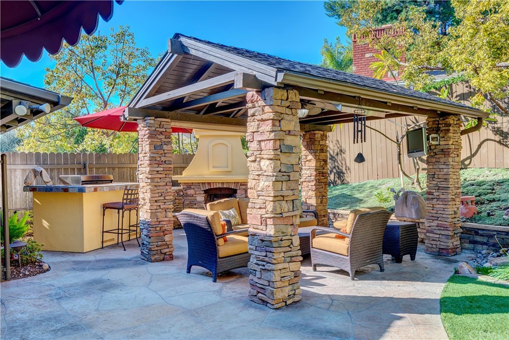 13719 Philadelphia Street Whittier, CA 90601 - Photo 29 of 45 Lovely entertainment area with built in BBQ island, TV, speakers, fireplace and heaters