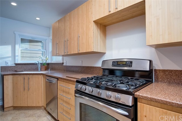 34096 El Contento Dana Point, CA 92629 - Photo 16 of 43 Remodeled Kitchen with custom bamboo cabinetry, stainless steel appliances, recessed lighting and corian counter tops.*Download 4 page Features list PDF for more details.
