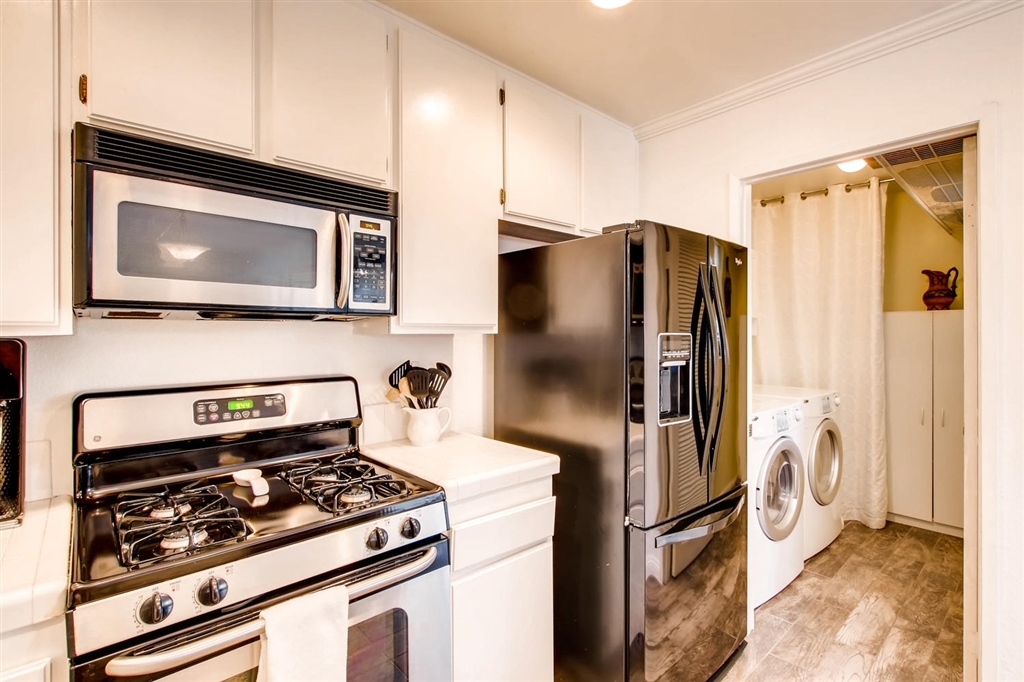 8434 Summerdale Road, Unit A San Diego, CA 92126 - Photo 10 of 25 Kitchen with view into laundry room