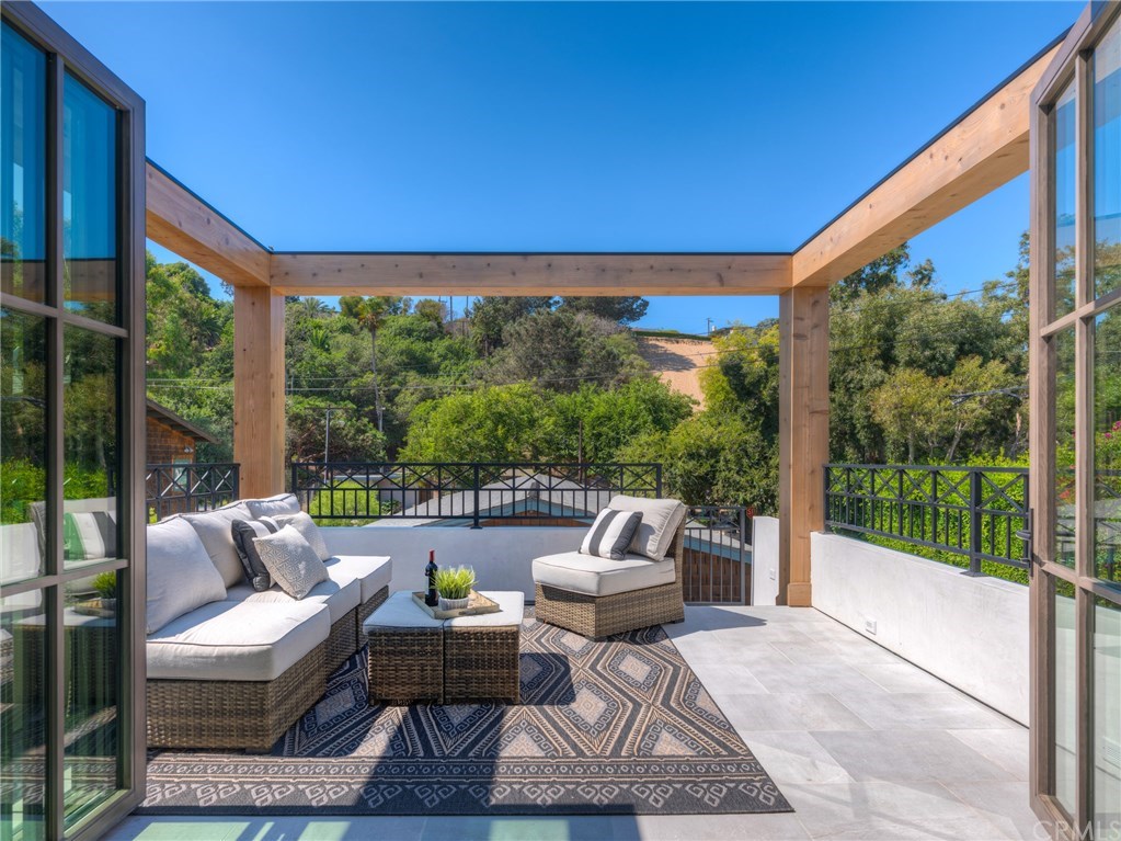 559 31st Street Manhattan Beach, CA 90266 - Photo 31 of 49 Private guest/in-law suite above the 3 car garage with outdoor sitting/patio area. LaCantina door systems for the perfect indoor/outdoor experience. Views of Sand Dune Park and just minutes from the beach.