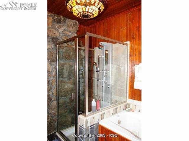 5395 Ona Road Cascade, CO 80809 - Photo 12 of 16 The master bath boasts a jetted tub and full body shower