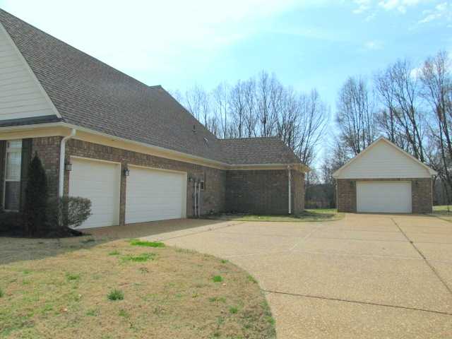 955 Woodbridge Road Somerville, TN 38068 - Photo 12 of 12 Side load 3-car garage plus detached garage that would be ideal for a workshop or to store those favorite "Boy Toys"