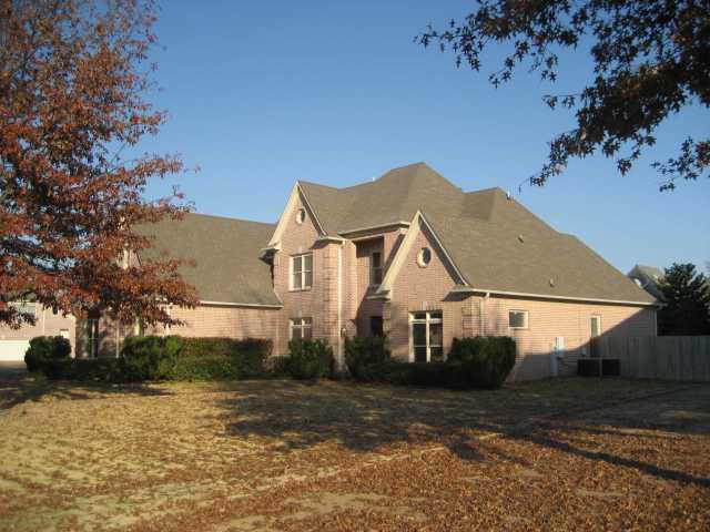 1824 Johnson Road Germantown, TN 38139 - Photo 1 of 15 Beautifully landscaped yard with Two mature trees not too close to the house! Plus, a nice corner lot!