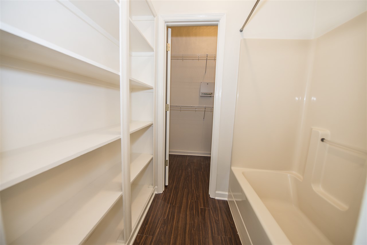 1237 Misty Isle Drive Memphis, TN 38103 - Photo 22 of 22 Features custom built shelving across from the shower for towels and other items. None of the other floorplans have this storage in the bathroom.