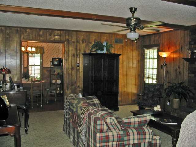 8027 Cinders Road Bartlett, TN 38133 - Photo 5 of 10 Newer neutral berber carpet, masonry fireplace w/gas logs, beautiful beam ceilings and more. Will hold a LARGE number of people and still feel roomy! Owner will offer an allowance for painting the paneling if needed!