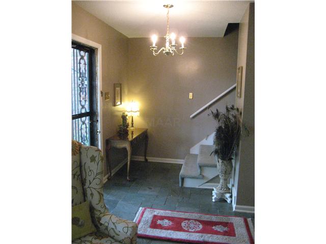 885 South Yates Road, Unit 4 Memphis, TN 38120 - Photo 2 of 9 Entry Hall with slate floors off of hardwood floors down. New carpet on stairs and entire upstairs. New paint throughout.