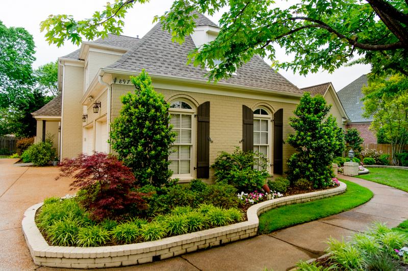 897 West Powell Road Collierville, TN 38017 - Photo 2 of 25 Beautiful landscaping, three car garage and an inviting friends and family entrance to the side welcome you to this exceptionally well kept home.