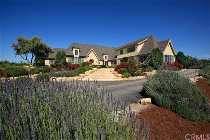 The luxurious 3,864 square foot custom home sits atop a knoll that takes in 360 degree wine country views.