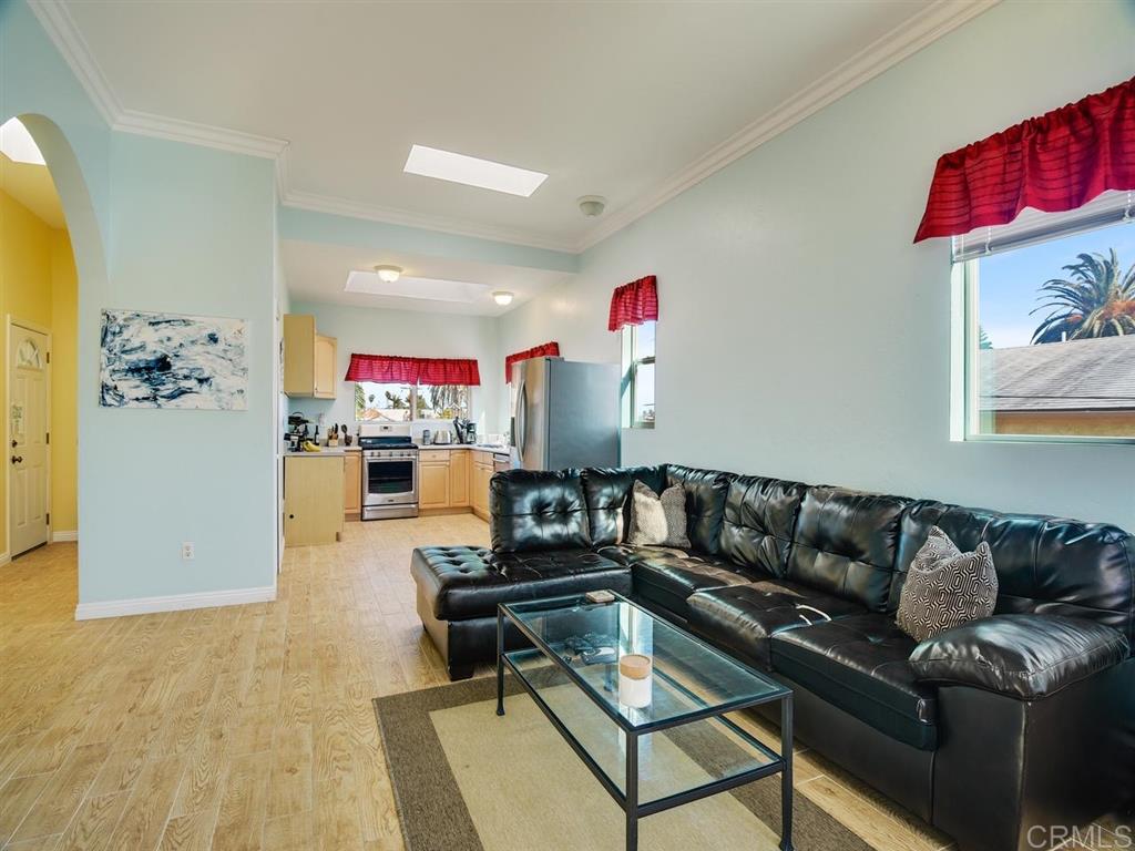 869 Beryl Street San Diego, CA 92109 - Photo 3 of 25 Living room of upstairs, 1 bedroom + loft. Tremendous light from numerous skylights, and ocean views from multiple windows.