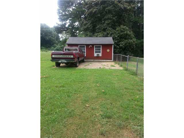 1073 Hale Road Memphis, TN 38116 - Photo 11 of 14 Storage shed with a window unit.