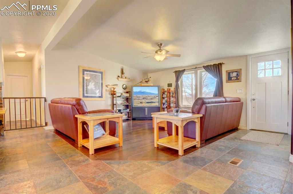 3235 South Meridian Road Colorado Springs, CO 80929 - Photo 9 of 36 Spacious living room with great views. Very nice hardwood.