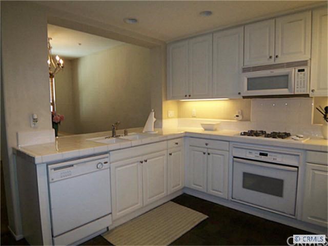 31 Passaflora Lane Ladera Ranch, CA 92694 - Photo 1 of 1 Breakfast Bar/Counter Opens Kitchen to the Dining Room