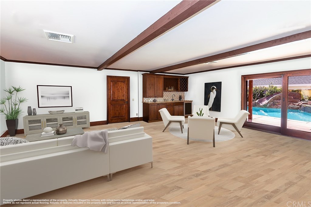 1773 Bahama Place Costa Mesa, CA 92626 - Photo 20 of 20 Family room is connected to the private pool and spa with large sliding door (virtually staged).