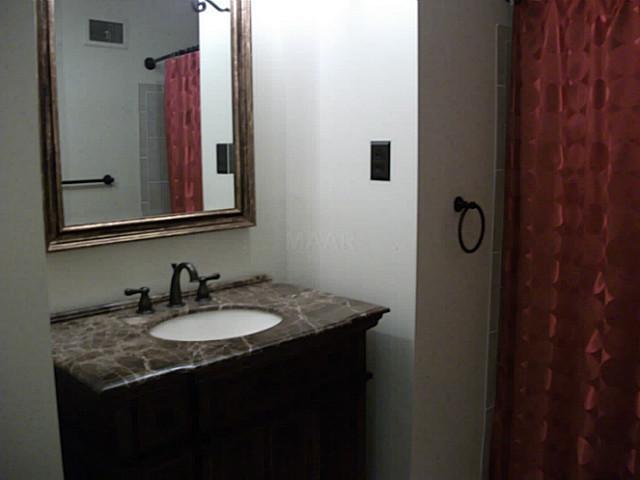 4250 Rhodes Avenue Memphis, TN 38111 - Photo 12 of 15 What a beautifully well done updated and upgraded hall bath! The whole bath has been redone with new tile flrs and tile ard. the bathtub; new oil bronze faucets; granite vanity with storage; new upgrd lighting; new bronze towel racks; new beveled mirrors