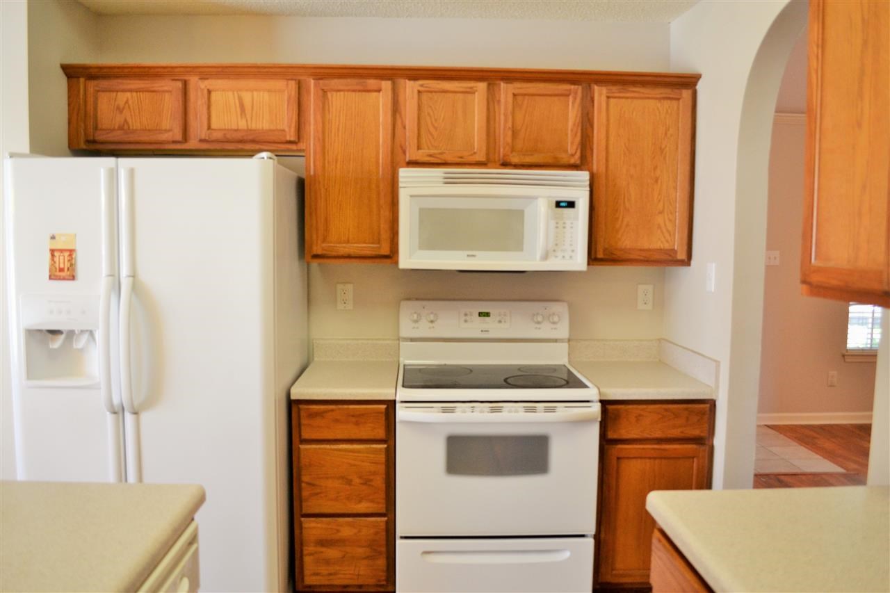10072 Cross Ridge Road Cordova, TN 38018 - Photo 7 of 25 Plenty of Cabinet space, mounted microwave and smooth top self cleaning oven! Seller will leave side by side refrigerator w/Water and Ice in the door upon request with acceptable offer!