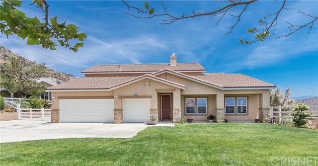 34662 Desert Road Acton, CA 93510 - Photo 1 of 1 Beautifully landscaped front entrance welcoming you to this fabulous home. The recently painted exterior is highlighted by the red entrance door.