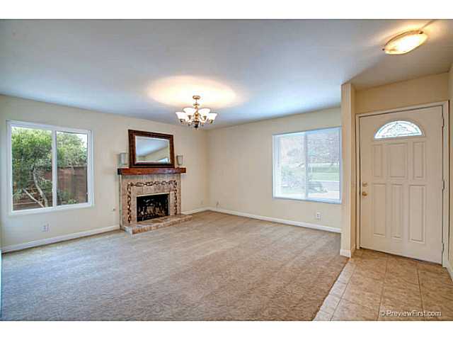 230 Village Green Road Encinitas, CA 92024 - Photo 4 of 19 Spacious living room with lots of light and a nicely remodeled fireplace