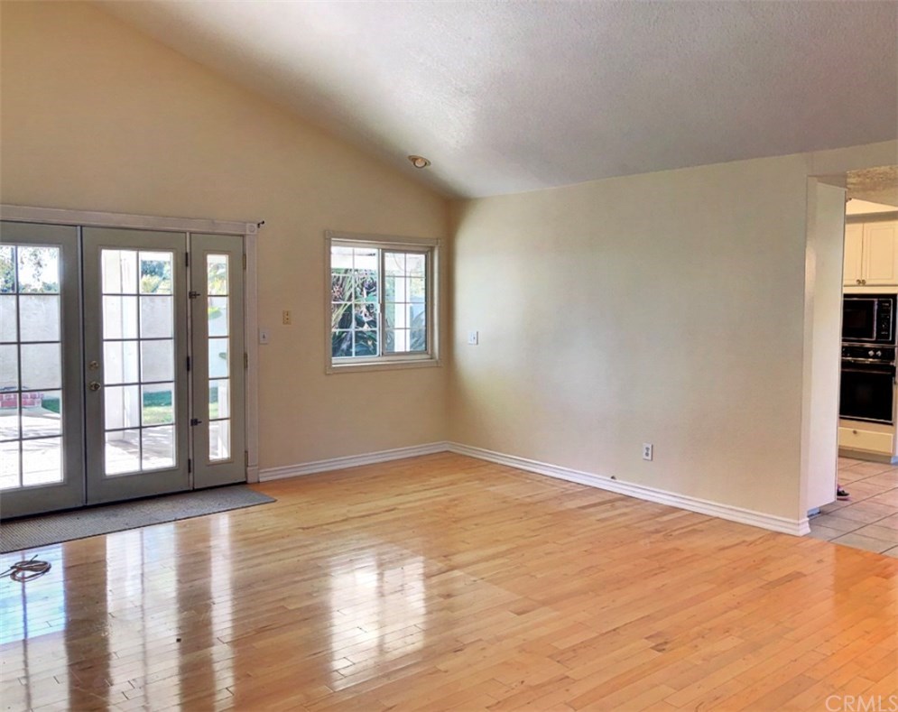 1092 Deborah Street Upland, CA 91784 - Photo 9 of 20 Large Family Room with vaulted ceiling and French Doors to backyard