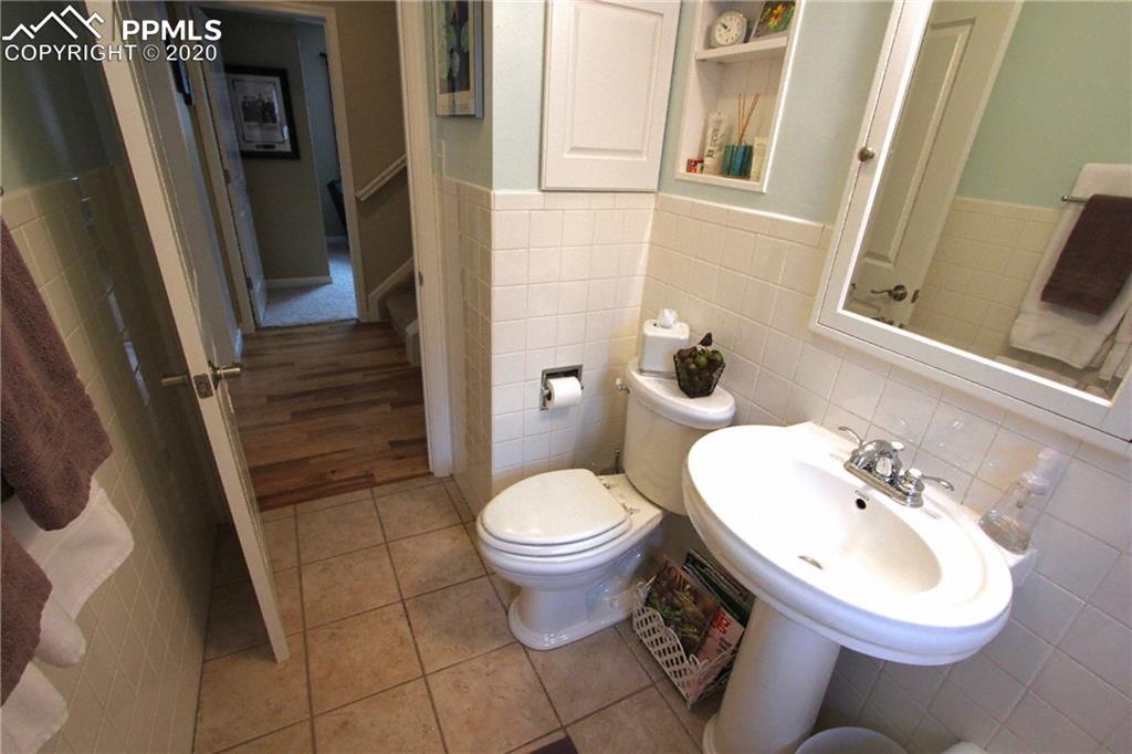 210 Crystal Park Road Manitou Springs, CO 80829 - Photo 24 of 34 Full Bath View 2. Access to Hall Linen Built-In Through Cabinet