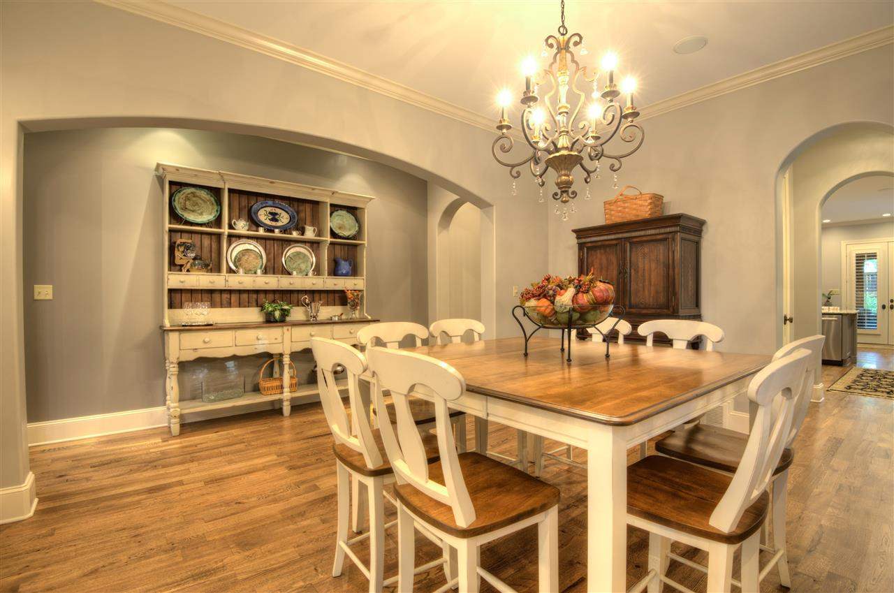 1277 South Dubray Place Collierville, TN 38017 - Photo 4 of 25 Gorgeous crown molding, hardwood floors, plantation shutters create an ideal setting for family gatherings in this beautiful 16x13 Dining Room