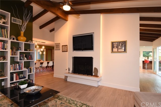 12 Harbor Sight Drive Rolling Hills Estates, CA 90274 - Photo 17 of 56 Last family room shot! Beautiful fireplace and TV nook above. Dining room and kitchen are beyond