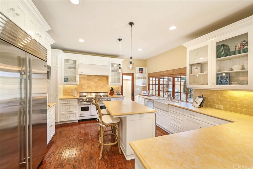 419 Signal Road Newport Beach, CA 92663 - Photo 5 of 23 Gourmet kitchen with stone counter tops and built in Subzero refrigerator.