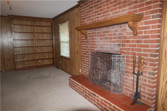 2266 Zion Road Columbia, TN 38401 - Photo 8 of 13 Family room features a fireplace and built in shelves