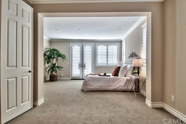 2148 Sageleaf Circle Corona, CA 92882 - Photo 22 of 74 The master bedroom. It has a retreat and the French door in the background lead to the balcony