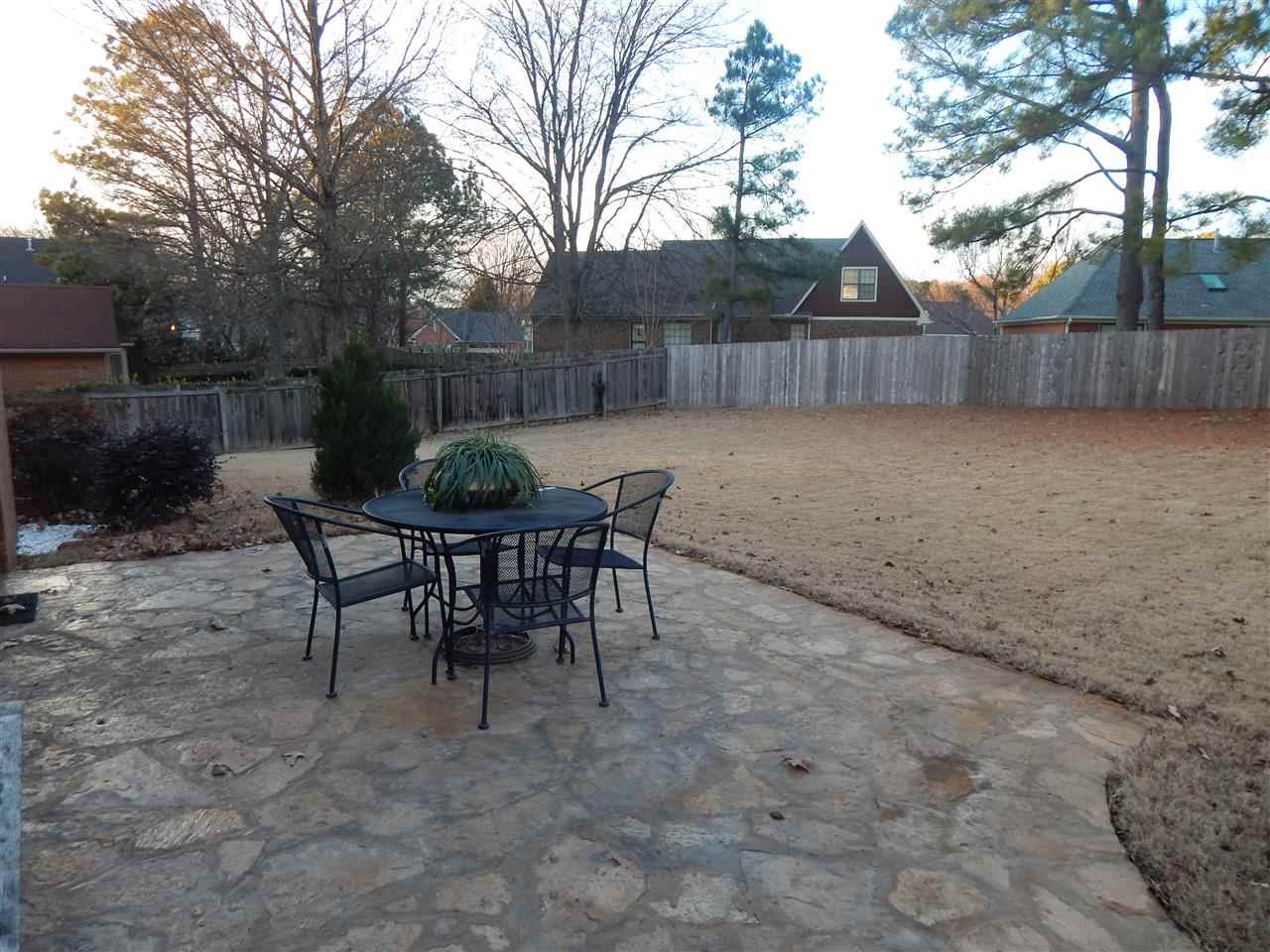8474 Dulwich Road Memphis, TN 38016 - Photo 21 of 24 Picture Perfect-- new extra large flagstone patio! Imagine that cup of coffee on your new patio, flocked by beautiful pots of flowers, the grass is green, and the kids have a huge yard in which to play!