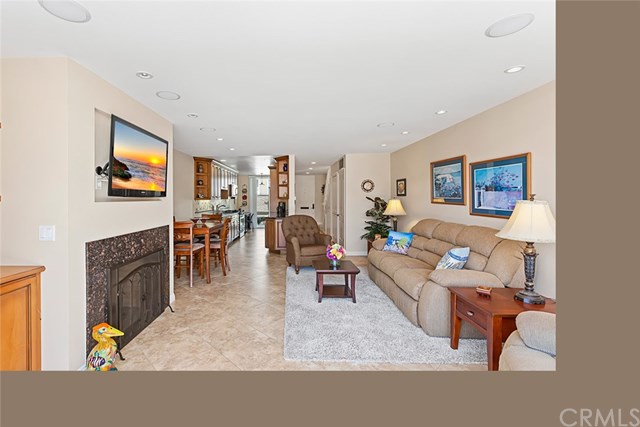 4002 Aladdin Drive Huntington Beach, CA 92649 - Photo 9 of 55 The galley kitchen opens to the living room for easy entertaining!