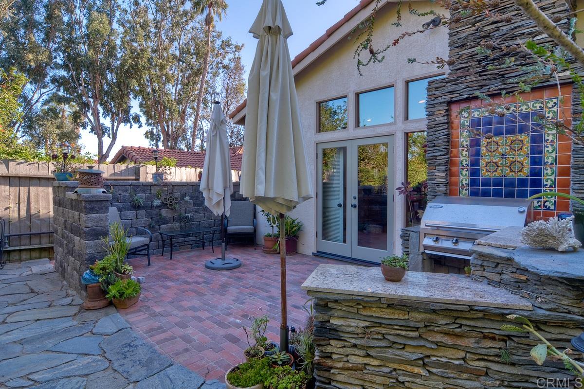 2136 Pleasant Grove Road Encinitas, CA 92024 - Photo 19 of 25 Bedroom with French doors opening to patio-garden area. Currently used as office with no closet but does have built-in custom cabinet