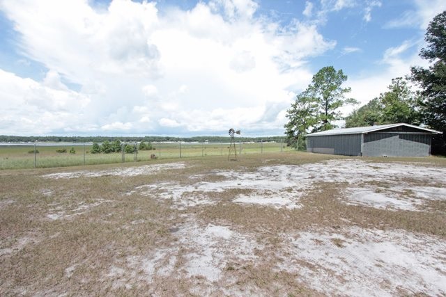 151-153 Bumpy Road Melrose, FL 32666 - Photo 22 of 25 Back Yard View 2 with Storage Shed