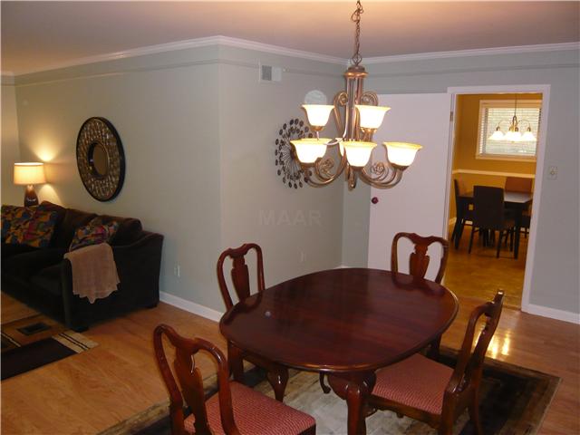 162 South Yates Road Memphis, TN 38120 - Photo 4 of 12 Dining room has nail-down hardwood floors.