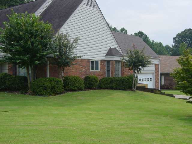 Well maintained corner lot with side load garage.  Side yard is part of cove.