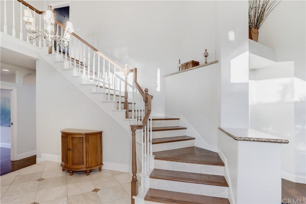 6 Via Colorso San Clemente, CA 92672 - Photo 3 of 32 Front door opens to bright open space, tile flooring, elevated ceiling, and spiral staircase!