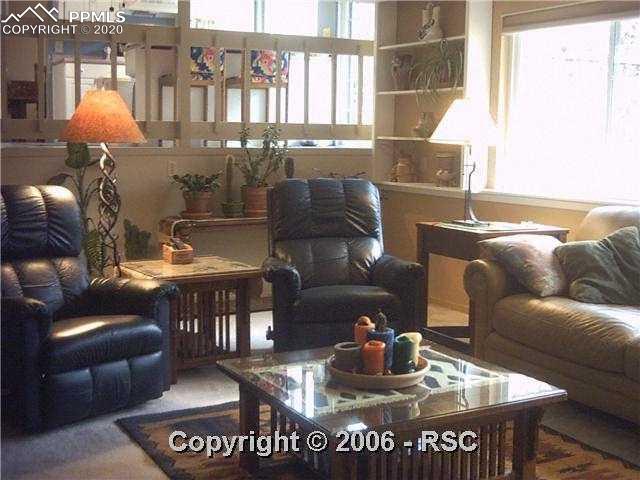 565 Gilcrest Road Colorado Springs, CO 80906 - Photo 8 of 13 FAMILY ROOM UP TO KITCHEN