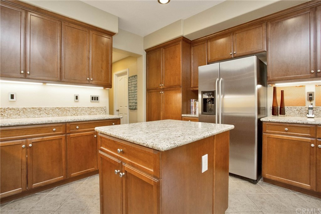 21 Corte Javier San Clemente, CA 92673 - Photo 2 of 30 Stainless appliances include the refrigerator, microwave, dishwasher and electric oven and gas stove.