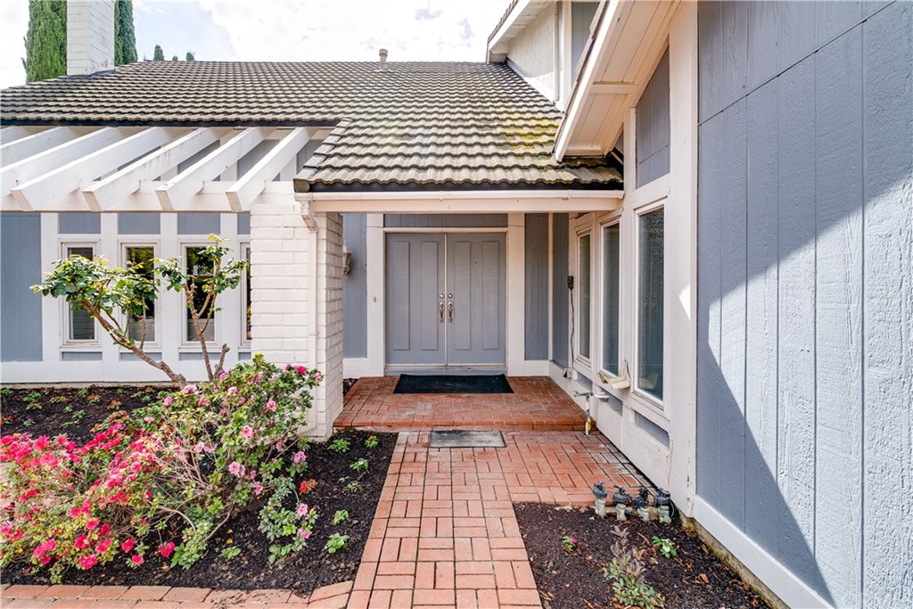 338 Purdy Avenue Placentia, CA 92870 - Photo 3 of 34 Enter your home via the gated courtyard with brick pavers to the double door entry