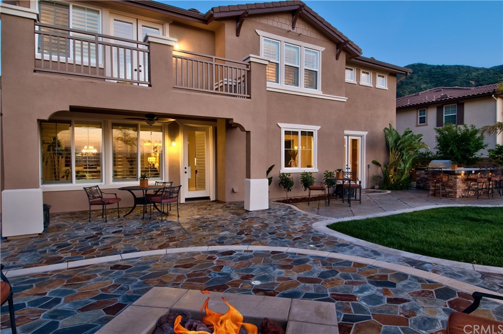 2148 Sageleaf Circle Corona, CA 92882 - Photo 17 of 74 The backyard is very elaborate. The hardscape includes expansive flagstone areas and custom concrete with granite inlays. The fire pit has a circular built-in seating area and there is also a Lanai/outdoor living area.