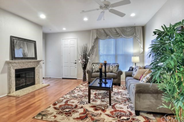 366 Quail Ridge Irvine, CA 92603 - Photo 1 of 1 Living room with hard wood floors, open floor plan to kitchen with room for formal dining table.