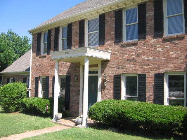 8516 Dulwich Road Memphis, TN 38016 - Photo 2 of 20 Lots of brick plus vinyl siding. The architecturally dimensional roof ties the color of the brick, vinyl and paint together for great curb appeal.