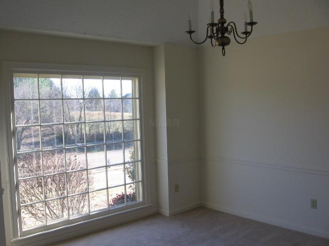 4827 South Germantown Road Memphis, TN 38141 - Photo 2 of 10 Dining room with tray ceiling and a picture window gives you the feeling of being on top of the world. It's a great place to entertain.