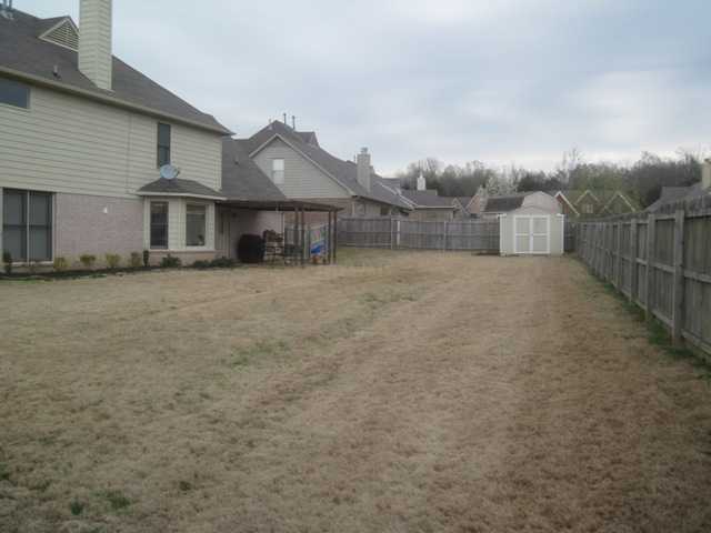 9171 Tryon Cove Memphis, TN 38018 - Photo 14 of 15 HUGE MANICURED FENCED BACKYARD!