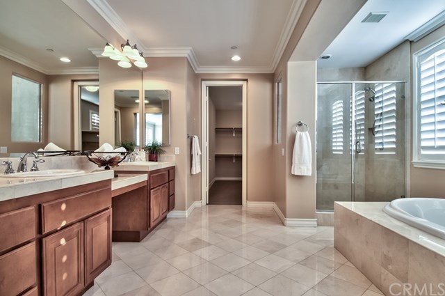 2148 Sageleaf Circle Corona, CA 92882 - Photo 26 of 74 Learn the true meaning of luxurious as you pamper yourself in the spa-like bath, featuring a Roman-style tub and a lofty walk-in closet.