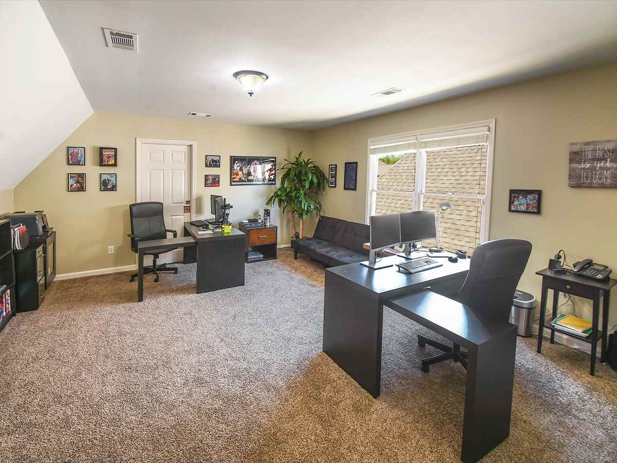 750 Southern Home Road Collierville, TN 38017 - Photo 14 of 23 This multi-functional room currently serves as home offices for the present owners who work from home. This great space is large enough for both office and play/family space.