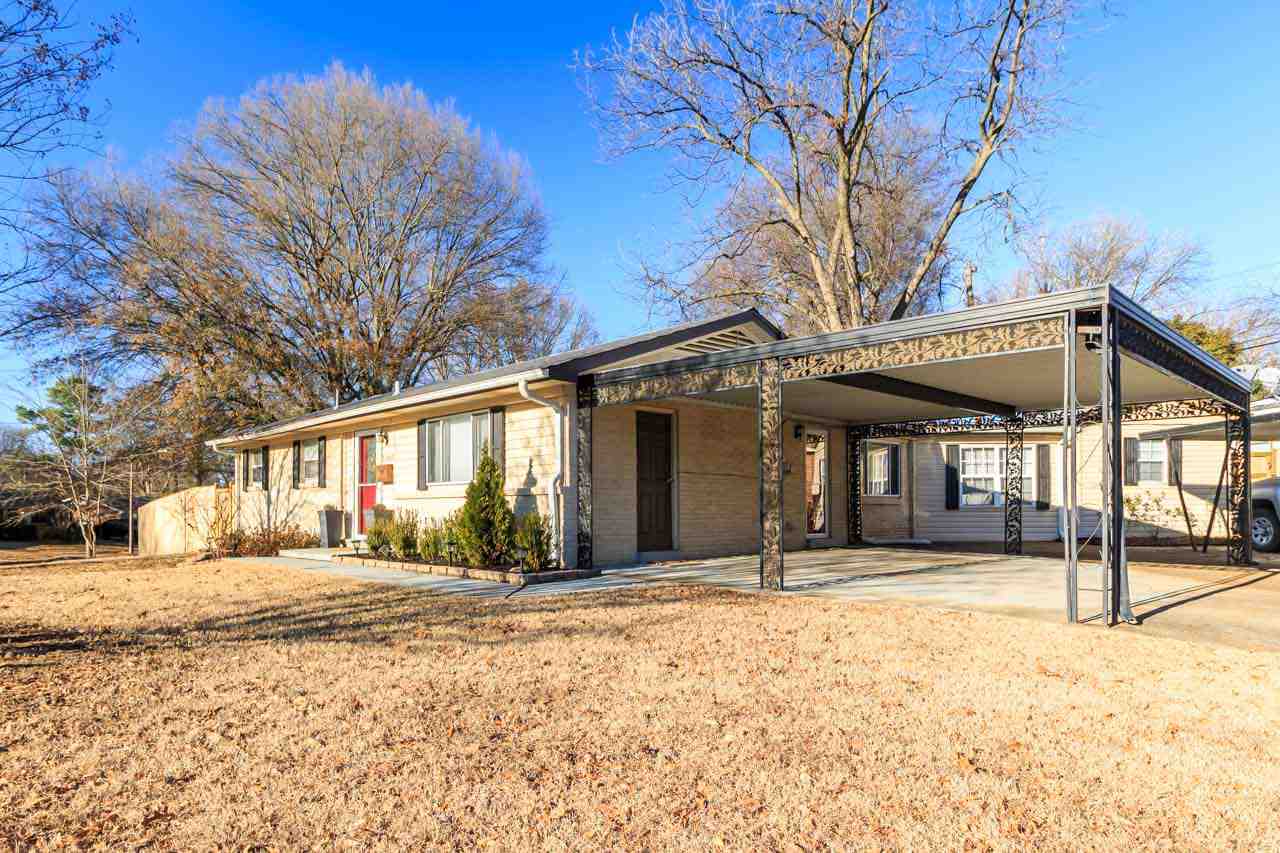 5180 Dee Road Memphis, TN 38117 - Photo 5 of 25 There are three covered parking spaces, with additional off-street parking in the long driveway. There is a storage room under the covered section as well.