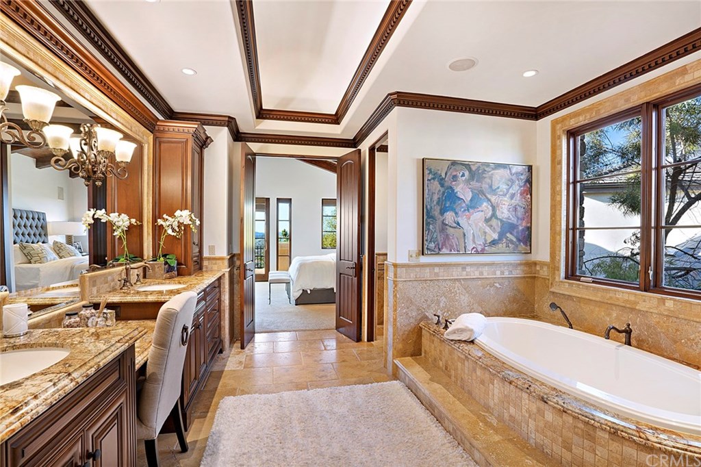 3 Fox Hole Road Ladera Ranch, CA 92694 - Photo 28 of 36 The beautifully appointed master bathroom features dual sinks, spa tub, separate shower, a vanity and lots of natureal light.