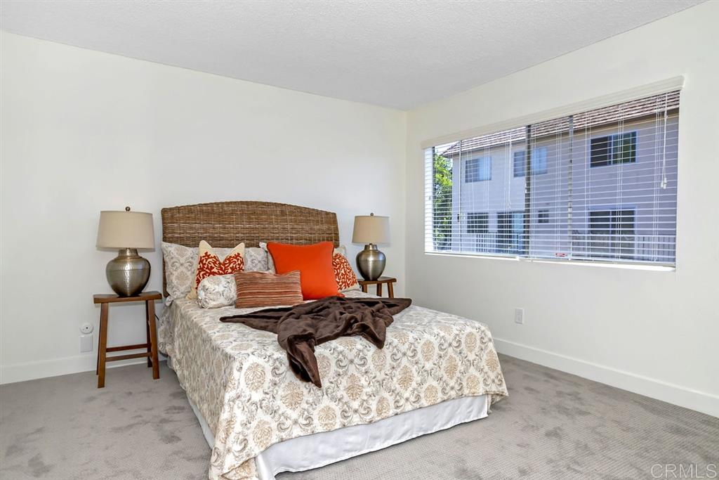 7855 Hummingbird Lane San Diego, CA 92123 - Photo 11 of 25 Extra large master bedroom features a walk-in closet and direct access to the bathroom.