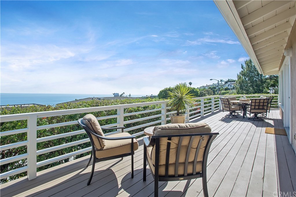 1588 Skyline Drive Laguna Beach, CA 92651 - Photo 9 of 18 Expansive deck with stunning ocean, sunset, and twinkling city lights views, perfect for indoor/outdoor dining, living and entertaining.
