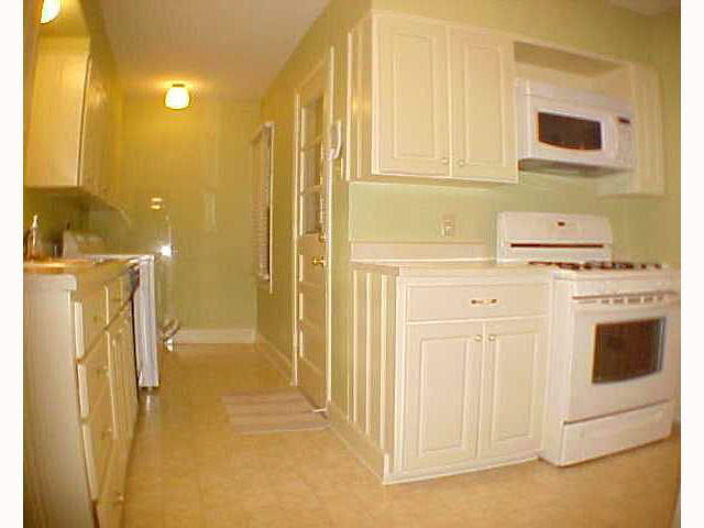 1577 Hayne Road Memphis, TN 38119 - Photo 7 of 10 All appliances stay. Ages are known for Washer, microwave and stove which are approximately 1 year old. Not shown in this picture is a small eat in area. There are 2 windows looking out to the cute back yard.